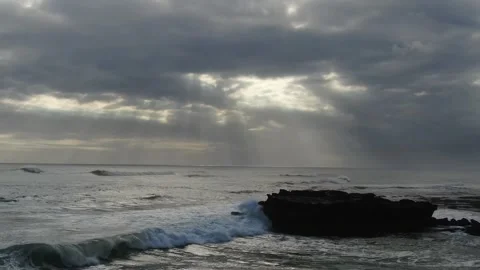 Drone close to Ocean cliff cloudy sun wave Stock Footage 303639020