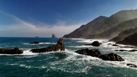 Drone close pass of coastal rocks and waves, Roque de las Bodegas, Tenerife Stock Footage 336446800