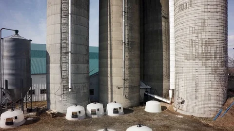 Drone close rising direct view of quebec dairy farm silos Stock Footage 93362996