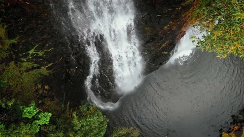 Drone close up shot of waterfall and the lake below at Opaekaa Falls, Kauai Video stock 136418571