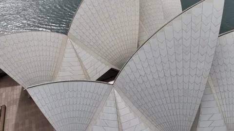 Drone close up of the Sydney Opera House. The iconic white sails and modern 動画素材 325379936