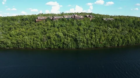 Drone Close-Up of a Timber Lodge Perched Above a Quebec Lake Stock-Footage 338326233