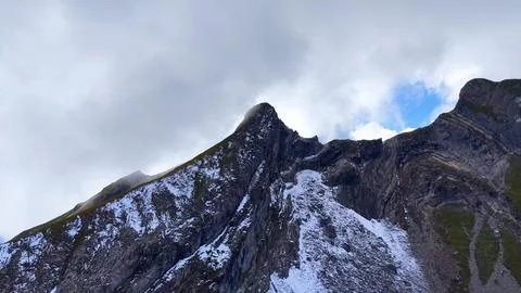 Drone Close View Of Rocky Alpine Peak With Snow Stock Photos
