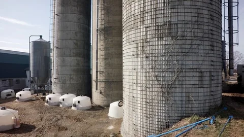 Drone closer rising direct view of quebec dairy farm silos Stock Footage 93363014