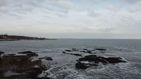 Drone Coastline Panning Down Over Ocean Stock Footage
