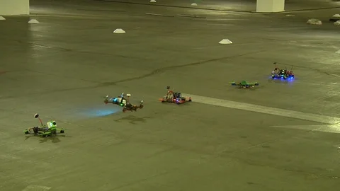Drone competition taking place in a parking lot Video stock 99050578