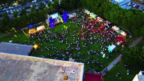 Drone concert stage with crowd circular flight 200 mts 45 degree afternoon Stock Footage 247943164