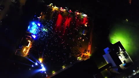 Drone concert stage with crowd circular flight 200 mts 0 degree to 50 mts 45 Stock Footage 247944033