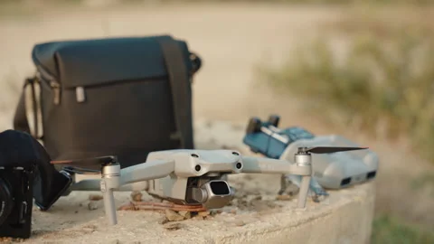 A drone with controller and bag,digital camera,close up, slow mo Stock Footage 252672578