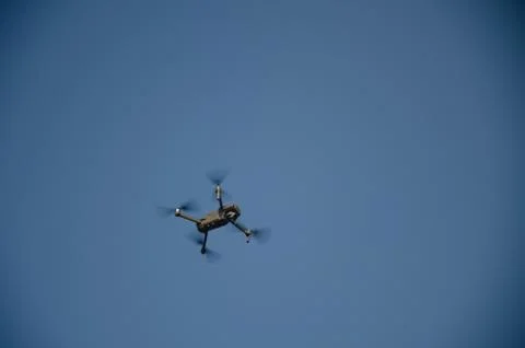 Drone copter with digital camera on the sky, Stock Photos