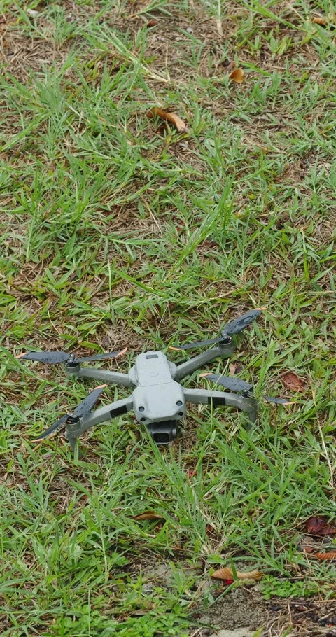 Drone copter on grass during rain Stock Footage 247159745