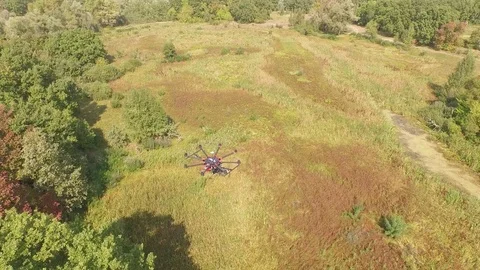 Drone copter UAV - aerial video shooting flying on eight propellers oktocopter Stock Footage 76037348