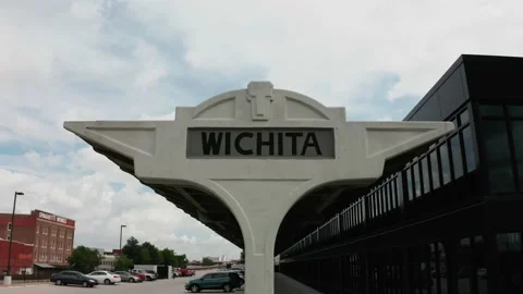 Drone crane lowering shot of train station sign in downtown Wichita Kansas 4k Stock Footage 155356435