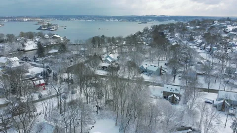 Drone crane up shot of Hingham, MA after a snowstorm.  Quincy Bay, Hingham Stock Footage 149225133