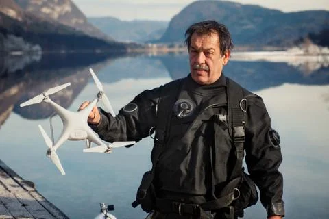 Drone Crash - Diver Holding a Retrieved Drone Stock Photos