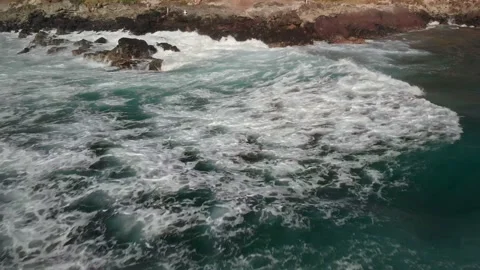 Drone crash. Drone crashes onto the rocks. coastal landscape of Hawaii. Drone 4k Stock Footage 133660358