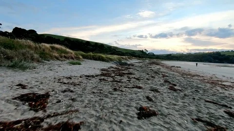 Drone crash during low level flight over beach Stock Footage 82733594