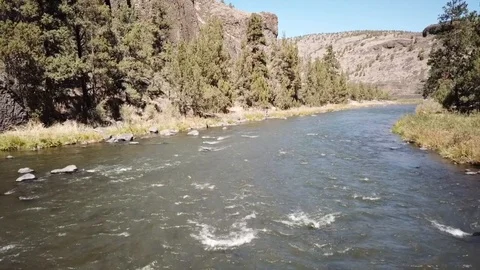 Drone crashes into remote high desert flyfishing stream canyon Stock Footage 95876267