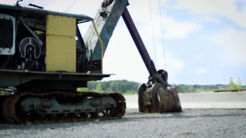 Drone crosses frame in front of old excavator truck Stock Footage 80151715
