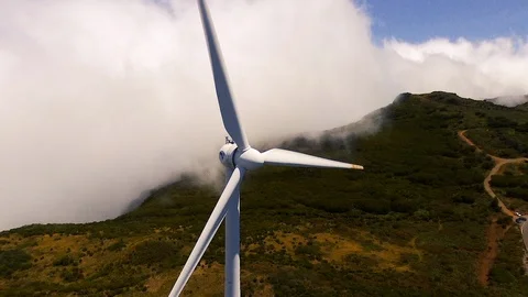 Drone crosses wind turbine Stock Footage 124791987