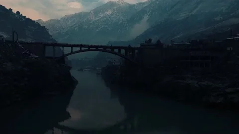 Drone crossing under bridge near tribal areas Kohistan Valley Khyber Pakhtunkhwa Stock Footage 234897958
