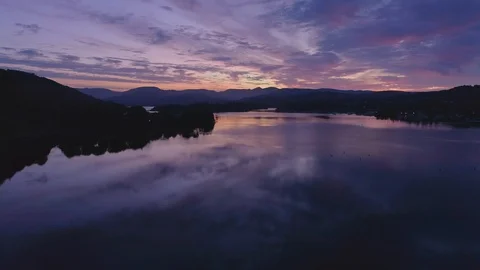 Drone Dark Lake Pull Back Boats Empty, Windermere Sunrise Lake District Video stock 102942306