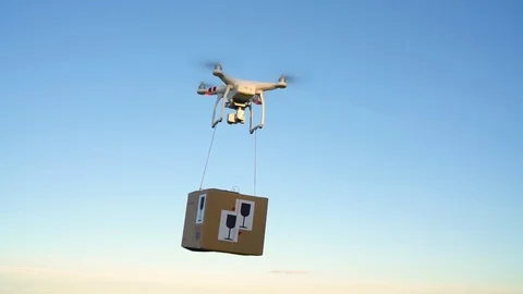 Drone delivering package on the sky background. Slow motion Stock Footage 78134082