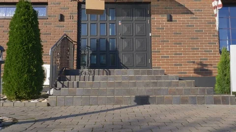 Drone delivers a package in front of a house Stock Footage 82431445