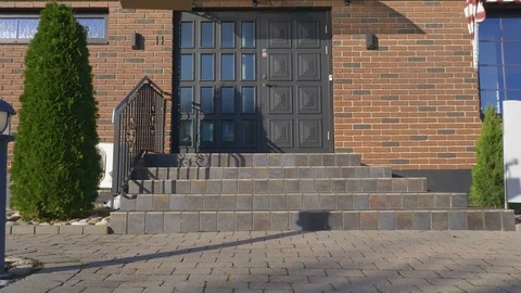 Drone delivers a package in front of a house Stock Footage 82431829