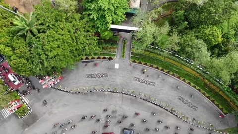 Drone Descend Shot of Runners Exercising on Spacious City Sidewalk Stock Footage 333497292