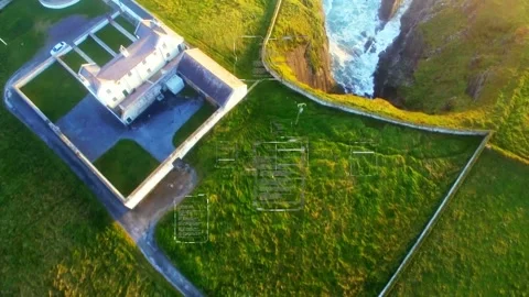 Drone descending camera drifting southeast tilting revealing lighthouse base and Stock Footage 333632133