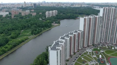Drone descending in circular path toward river Stock Footage 333415377