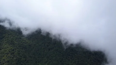 Drone Descending from the Clouds Above Monteverde in Costa Rica in 4K Stock Footage 93852654