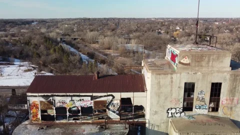 Drone descending down abandoned grain elevator tower Stock Footage 152170620