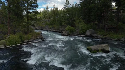 Drone Descending Forward Over White Water in River on Clear Day  Video stock 249821431