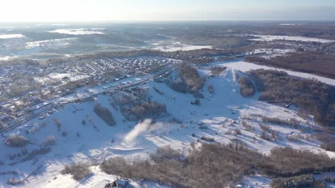 Drone descending forward over winter ski terrain Video stock 322641471