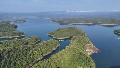 Drone descending over Ta Dung Lake at sunrise, Dak Nong, Vietnam 動画素材 337404913