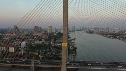 Drone descending on Rama 8 Bridge with skyline and river in view Stock Footage 232829596