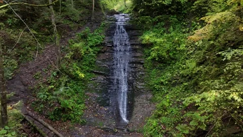 Drone Descending While Maintaining Distance from Bursuc Waterfall Putna Video stock 288720175