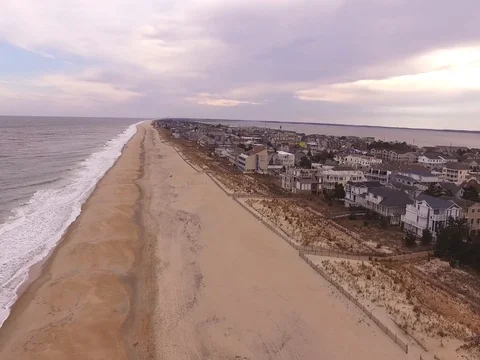 Drone  descends over beach Stock Footage 82574771