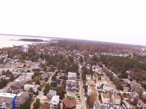 Drone descends over Beach town Stock Footage 82574737