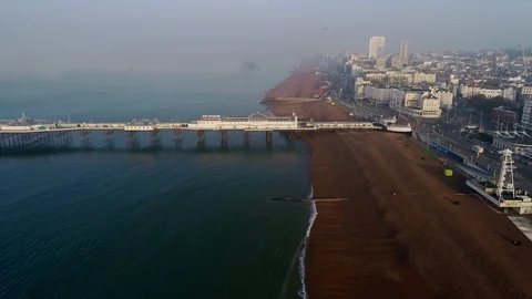Drone descends over Brighton Beach Stock Footage 89663502
