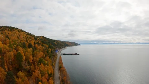 The drone descends over an empty coastal road. Aerial autumn landscape Stock Footage 126131785