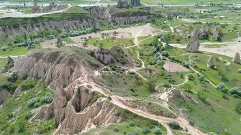 Drone Descends Over Red Valley Foothills Toward Mountain, Cappadocia Stock Footage 343318020