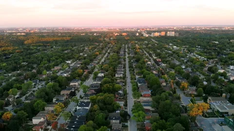 Drone Descends over a Small Town Neighborhood Near a Skyscraper Stock-Footage 347152298