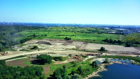 Drone Descends over an Undeveloped Landscape with a Pond Stock-Footage 347151021