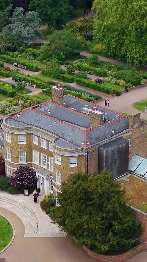 Drone descends over William Morris House at Lloyd Park, Walthamstow, London Stock Footage 336933832