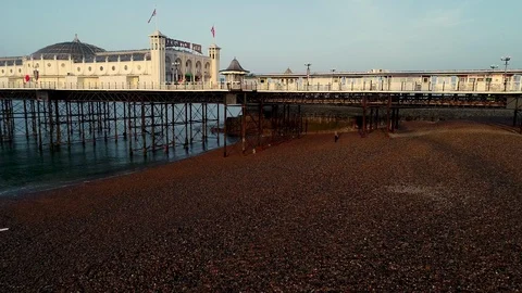 Drone descends slowly at low level by Brighton Pier Stock Footage 89662823