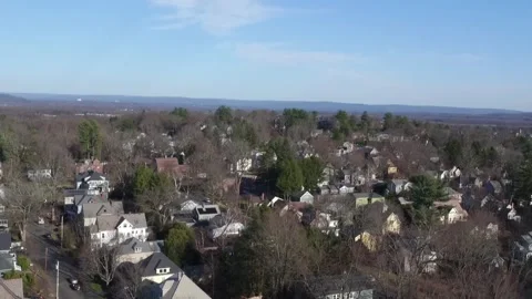 A Drone Descends While Showing A Residential Neighborhood. Stock Footage 329713558