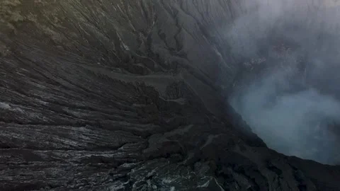 Drone Descent Inside Smoking Volcano Crater with Inner Wall View Stock Footage 315117717